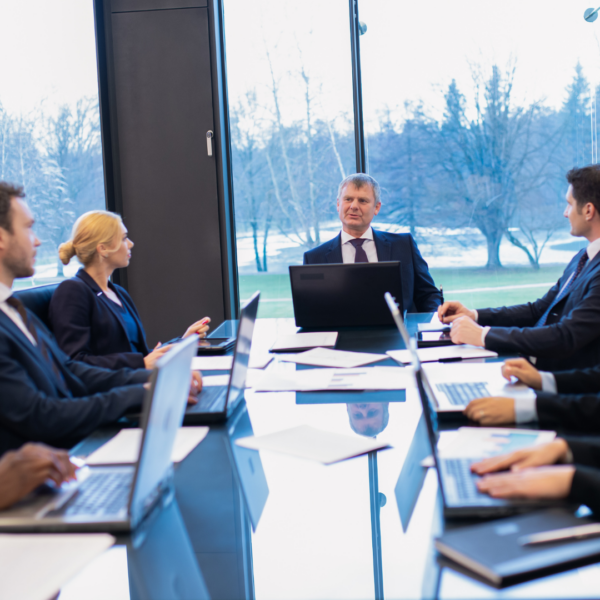 Business people sitting around a conference table