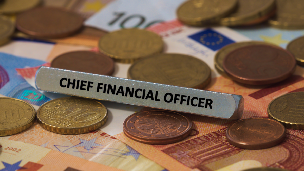 "CFO" name plate on top of money