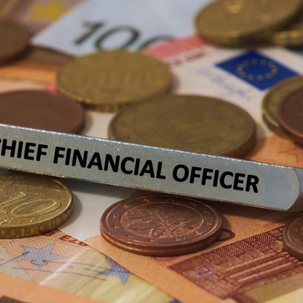 "CFO" name plate on top of money